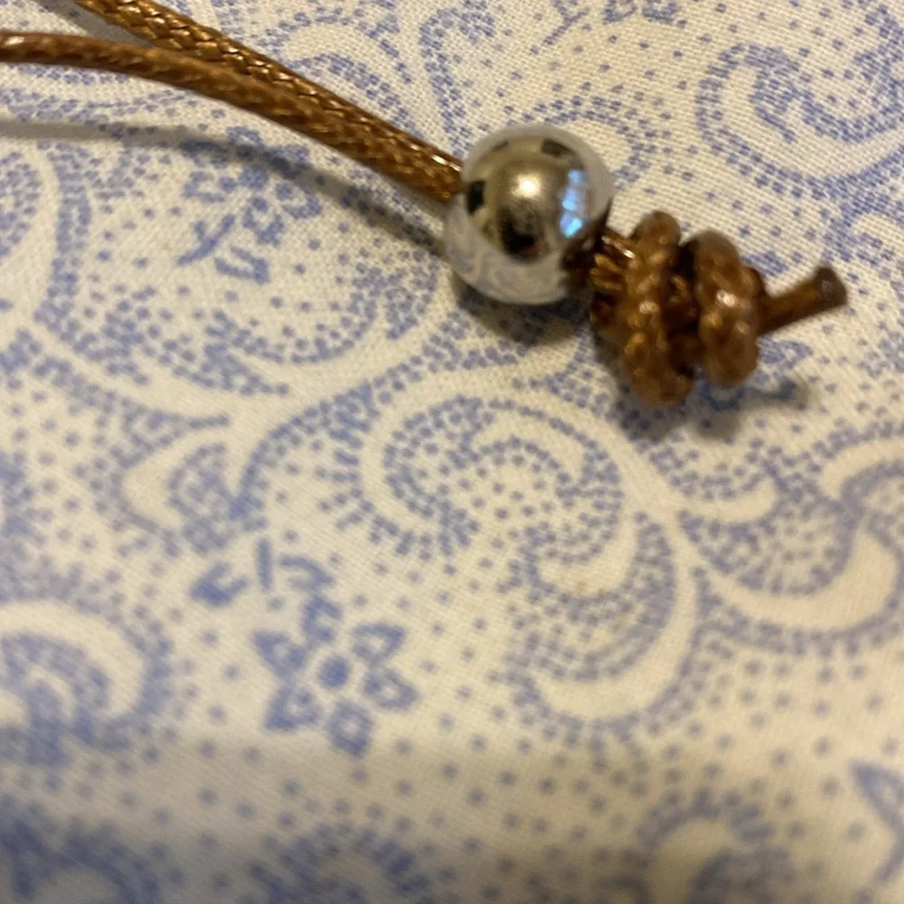 Very cool handmade necklace with beads, stone and seashell.